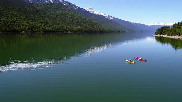 People kayaking in lake 4k