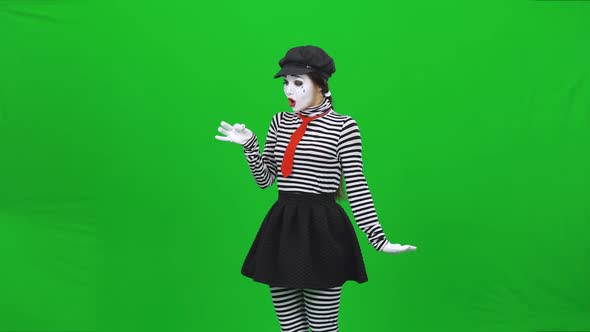 Mime Girl Has Found Dandelion, Blowing on It