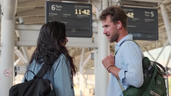 Man and Woman on Railway Station Waiting Train