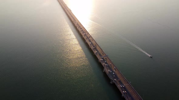 Aerial view fishing boat move near Penang Bridge