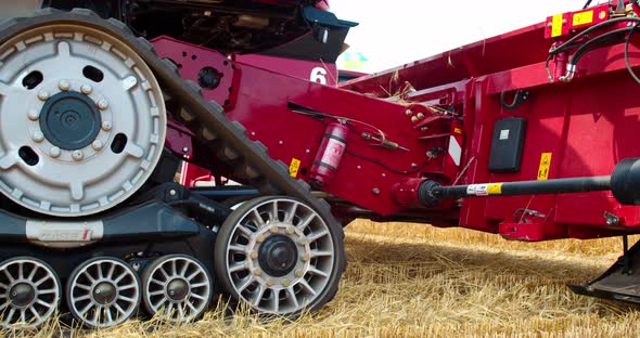 Combine Harvester Operating on Wheat Field During Harvesting Season Film Grain