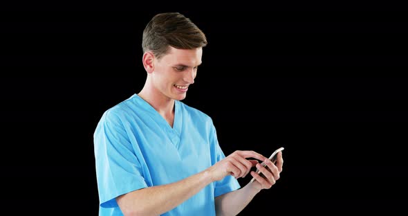 Smiling surgeon using mobile phone