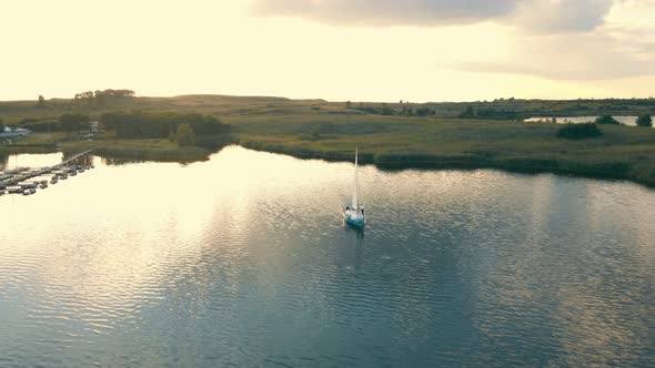 Aerial View on Top One Yacht in the Sea at Sunset