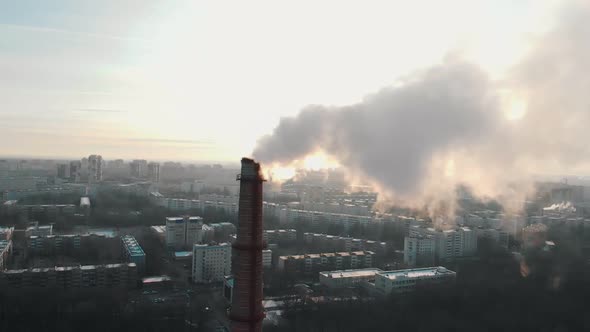 Air Pollution Problem - a Smoke From Industrial Pipe Pollutes the Air in the City