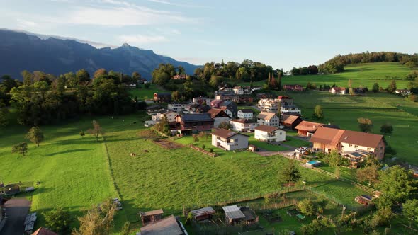 Aerial View of Liechtenstein with Houses on Green Fields in Alps Mountain Valley