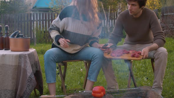 Woman Putting Vegetables on the Grill