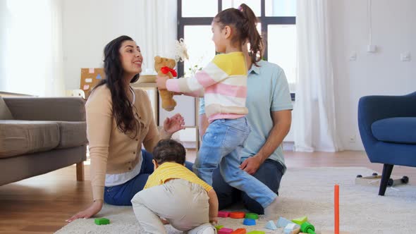 Happy Family with Children Playing at Home