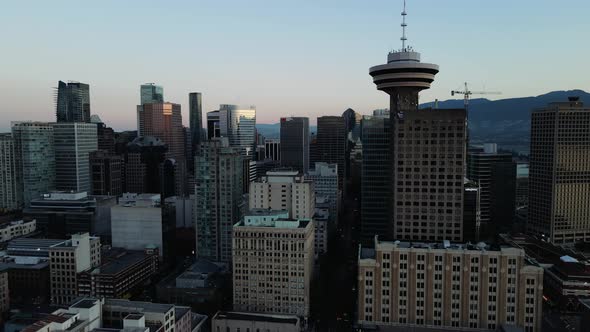 aerial drone footage of downtown Vancouver buildings, gas town, early sunrise, morning urban view. (
