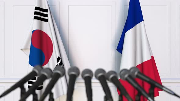 Flags of South Korea and France at International Press Conference