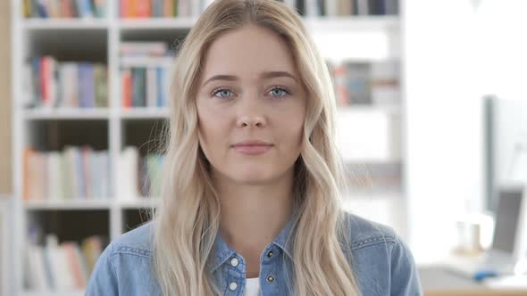 Portrait of Young Woman in Office