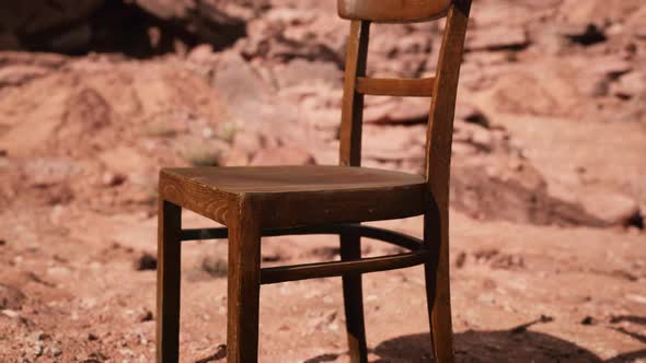 Old Wooden Chair on Rocks of Grand Canyon