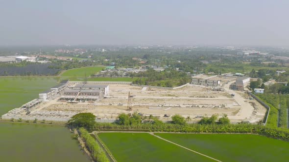 Aerial view of dry ground rough cracks in the land with sand in factory industry for construction