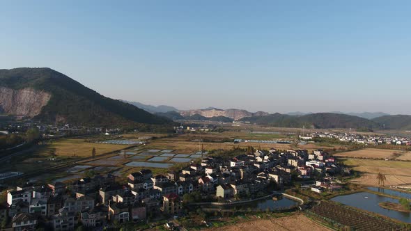 Mountain village and farmland in the sunset