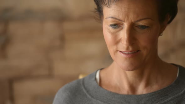 Face of Happy Mature Beautiful Woman Thinking While Drinking Coffee