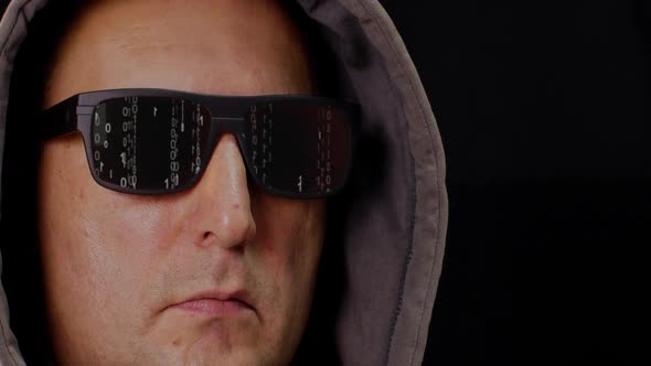 Man in Hood and Eyeglasses with Digital Rain Matrix