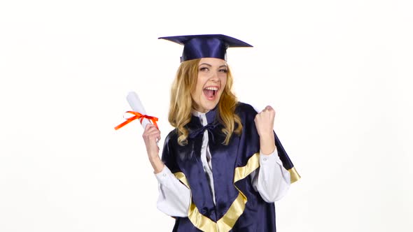Woman in Graduation Gown Holding Diploma. White