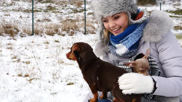 Woman with Dogs Outside. Winter