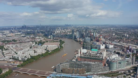 Old Coal Burning Battersea Power Station at Thames River Bank and Modern Apartment Houses Around