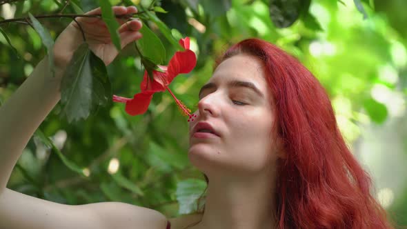 Girl smelling a flower