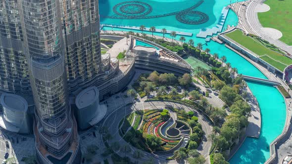 Dubai Downtown Timelapse with Fountain and Traffic on Circle Near Entrance to Tallest Skyscraper