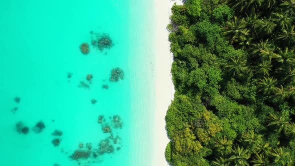 Aerial top down travel of tropical resort beach adventure by blue water and bright sand background o