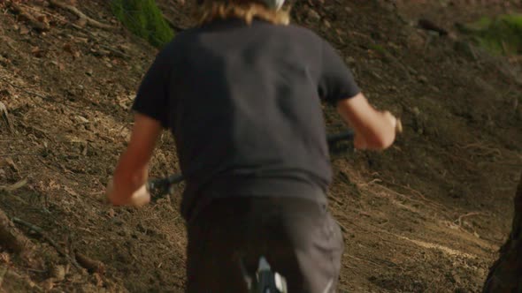 Mountain biker kicks up dust in slow motion