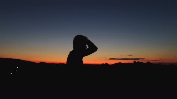 A man silhouette at amazing sunset.