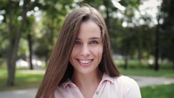 Portrait outdoor. Portrait of attractive woman looking at the camera feels happy girl.