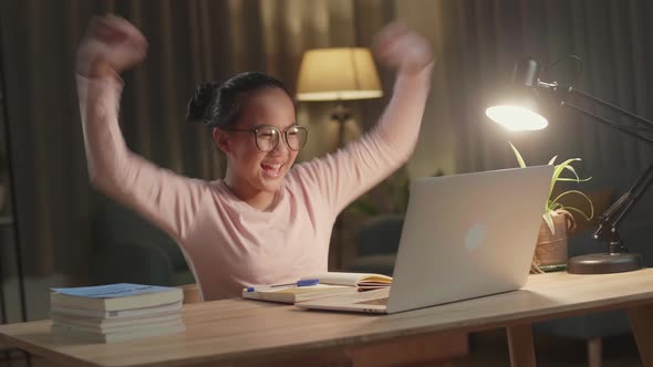 Young Asia Girl Student Celebrating With Laptop Computer At Home