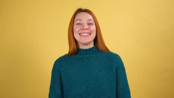 Young Red Hair Woman Posing Isolated on Yellow Color Background Studio