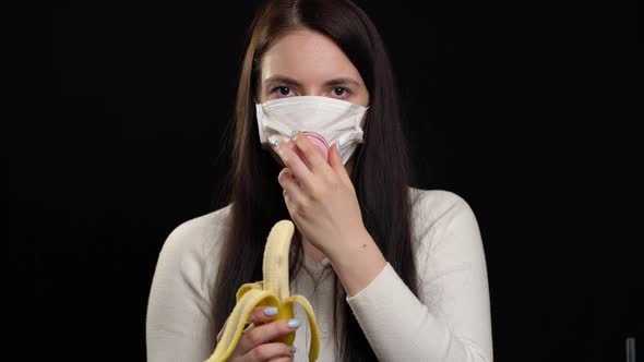 Woman with Handmade Protective Mask on Black Background