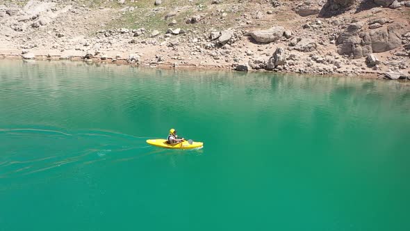 Man Canoeing On The Lake