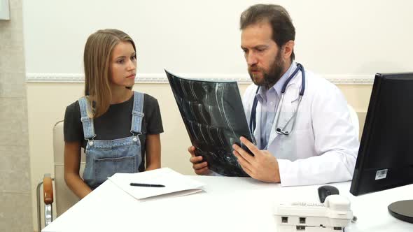 The Doctor Is Writing a Prescription and Smiling