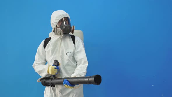 Male Disinfector Cleaning the Area in Building, Getting Rid of Coronavirus Infections Around