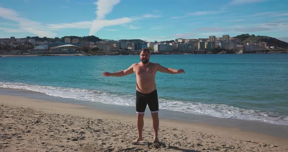 A Man Jumps on the Beach