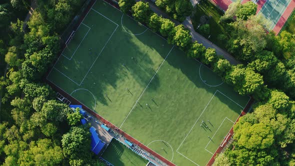 Aerial Top Down View of Soccer Field During Two Teams Playing Football