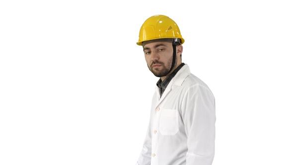 Unhappy construction site engineer talking and walking