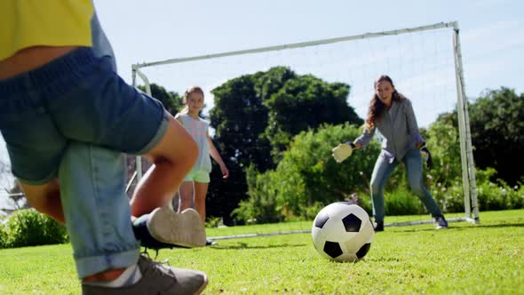 Happy family playing football