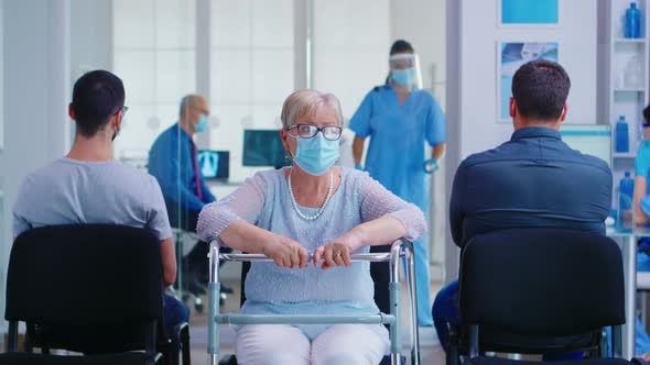 Senior Woman with Walker in Hospital Waiting Area