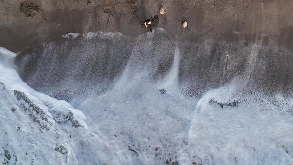 A Man Searches for Gold After a Storm Aerial View 4 K Turkey Alanya