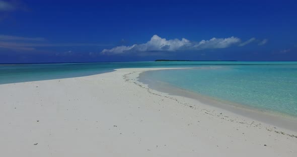 Natural flying clean view of a summer white paradise sand beach and aqua blue water background in be