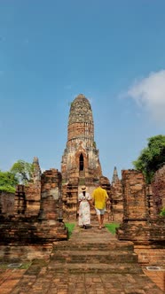 Ayutthaya Thailand at Wat Ratchaburana Couple Men and Women with a Hat Visiting Ayyuthaya Thailand