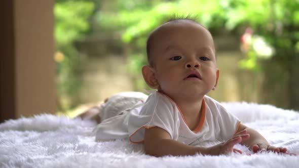 Happy portrait baby boy playing alone