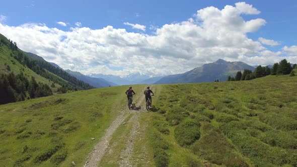 Aerial view of a mountain biker on a scenic singletrack trail