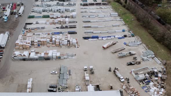 Aerial Drone View of Truck Repair Shop Service Building and Many Trucks Near It