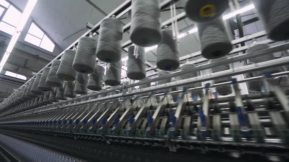 Spinning Factory Production of Fabrics Thread of Silk Linen and Synthetics View of Spools of Thread