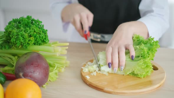 A Young Woman Is Cooking. Healthy Food - Vegetable Salad. Diet. Dieting Concept. Healthy Lifestyle