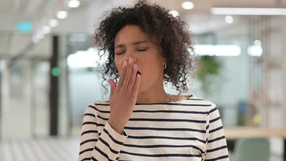 Sleepy Young African Woman Yawning