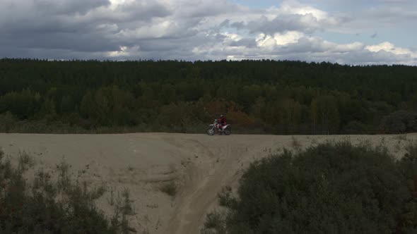 Enduro Motorcycle Rides Offroad on the Sands