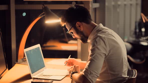 Workaholic Businessman Working In Office.Overwhelmed Tired Worker Overworked On Computer In Office.